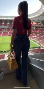 Milf in tight grey jeans and knee high boots with enormous heels, then in swimsuit