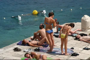 Nude girls on a beach in Hvar, Croatia