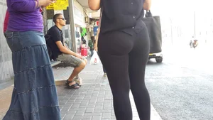 Sexy ass in leggings waiting for the bus