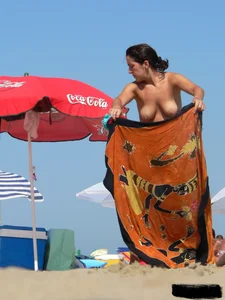 2 topless thonged sexy friends on the beach with great bodies