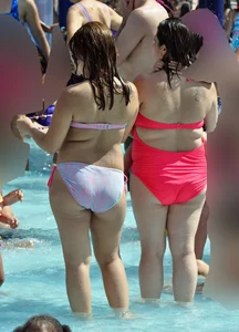 Two thick milfs at the pool in bikinis