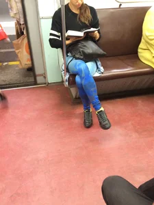 Girl in Blue Spandex Tights Reading in the Subway Train Candid