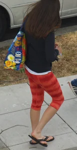 Beautiful brunette teen in orange patterned leggings