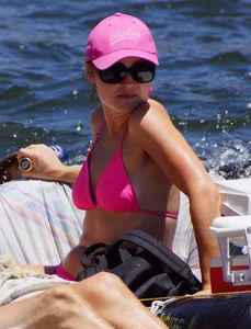 Sexy party girls in bikinis on a lake