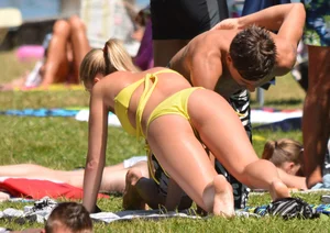 Blonde looking sexy in a yellow bikin