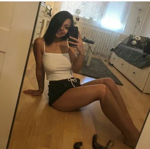 Hot Latino Girl in Mini Shorts With Awesome Long Legs Sitting on the Floor Mirror Selfie