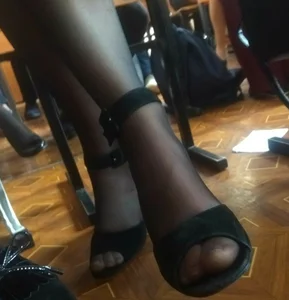 Feet Closeup Creepshot of a College Girl in Sandals and Pantyhose Sitting With Crossed Legs