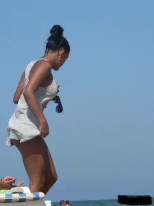 Hot ass topless beach girl with great tits lets her little brother oil up her ass in thong bikini