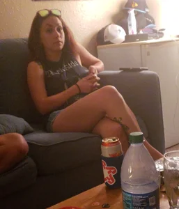 Girl With Tattooed Legs Sitting Cross-Legged on the Couch Home Busted Creepshot