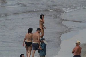 Girls on a nude beach in Sitges, Spain
