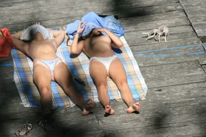 Two teens stripping and going topless to tan