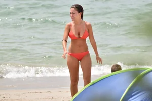 Two sexy ass girls on the beach in bikinis