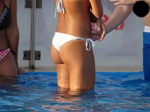 Sexy bikini babe in a white bikini at the pool with camel toe