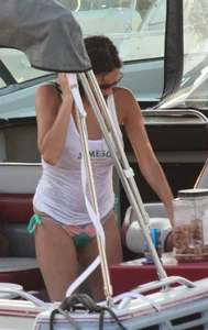 Bikini babe on a boat with a wet see through white shirt showing her tits