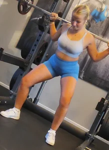 Small blonde pawg in light blue pants squatting as low as she can. Frontal view. OC