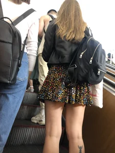 Candid Girl in a Skirt With a Tattoo on Her Calf Subway Escalator Creepshots Gallery
