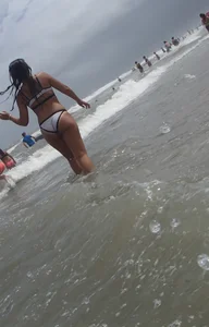 Sexy thick brunette babe in bikini on the beach