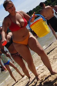 Thick girl with tattoos, big tits and a big booty in a little bikini