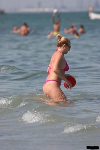 A bunch of sexy beach voyeur babes in bikinis, thongs and topless