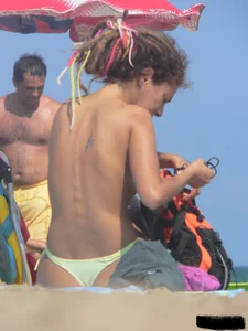 Sexy girls going topless at the beach showing off their sexy bodies