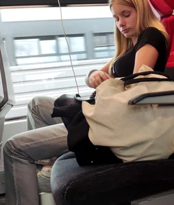 Hot busty blonde on train