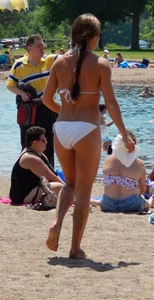 Lady with nice tits in a white bikini on the beach
