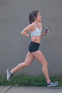 Beautiful girl out for a run in spandex shorts