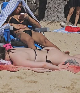 Cute petite in string bikini. Careful it will wink at you