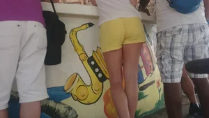 Milf in yellow shorts with vpl and a wedgie