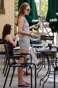 Sexy girl in a tiny grey skirt with decent ass