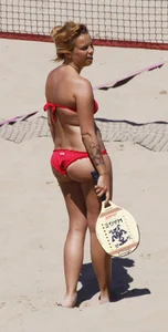 Redhead with nice ass and back dimples in red bikini on the beach