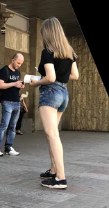 Cute Girl Distributing Leaflets in Shorts City Candid Gallery
