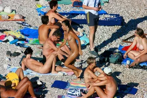 FKK Nudists playing in the water with floater