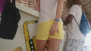 Milf in yellow shorts with vpl and a wedgie