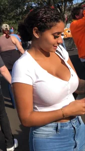 Huge tits in a low cut white top and tight jeans