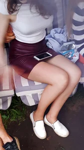 Girl in Short Skirt with Hot Legs Sitting with Her Phone Candid Pics