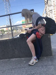 Blonde Girl Busy with Her Smartphone on the Street Candid Gallery