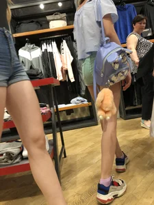 Girl with Amazing Hot Legs in Denim Shorts in a Store Candid