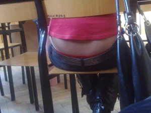 Closeup Photo of a College Teen Girl’s Lower Back - Dressed in a Pink T-Shirt And Tight Blue Jeans