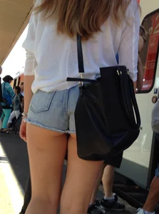 Gorgeous candid chick in jean mini shorts at the railway station