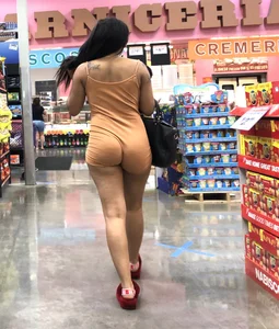 Latina with hard nipples and a big booty in tight spandex shorts outfit