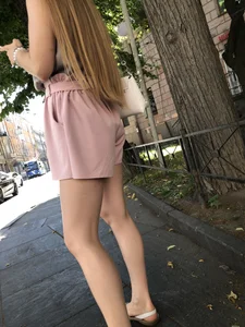 Cute candid girl in pink shorts street photos