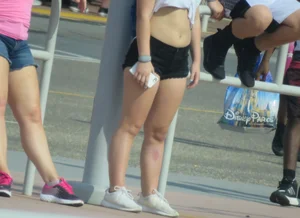 Couple of babes standing around in shorts