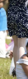 Pale milf in a skirt giving a peek at her green panties