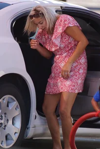 Sexy blonde upskirted in pink dress while cleaning her car