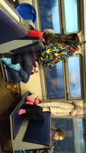 Cute candid teen in tight jeans and socks asleep, curled up in a public train video