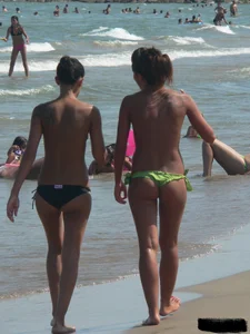 Bunch of sexy babes at the beach in thong bikinis