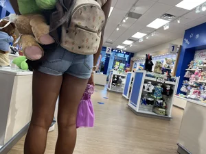 Hot ebony girl in shorts at the store