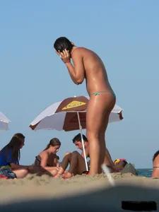 2 topless thonged sexy friends on the beach with great bodies