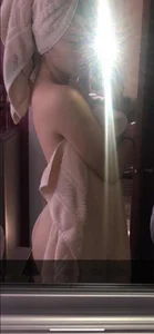 Girl With Her Body And Hair Wrapped in Towels Taking a Mirror Selfie After Shower, Her Naked Booty Partly Showing